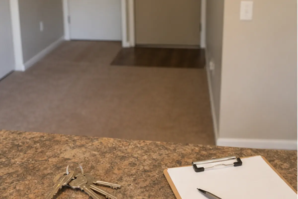 Technician examining traffic lanes in an empty apartment bedroom