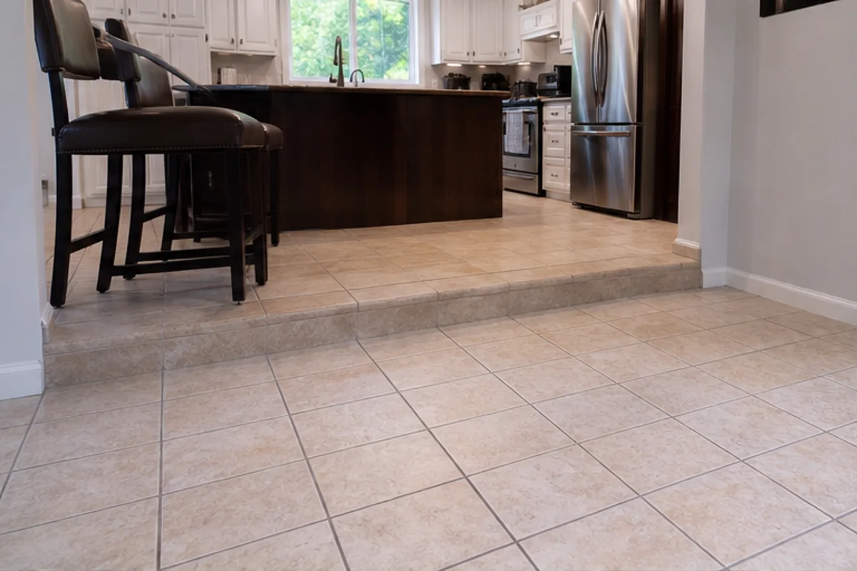 A clean kitchen or entry with detailed tile flooring and warm daylight in a Highland home for tile & grout cleaning
