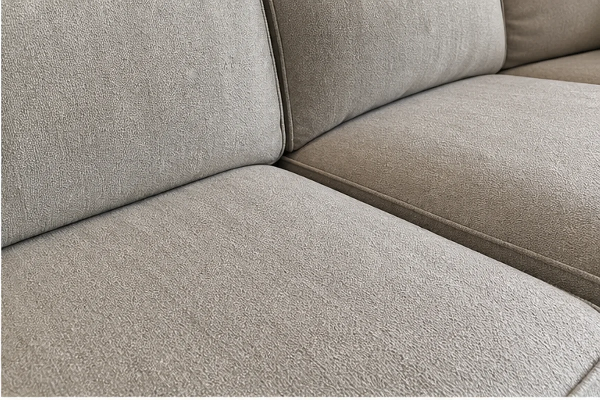 Close professional detail of upholstery cleaning assessment in a St. John home